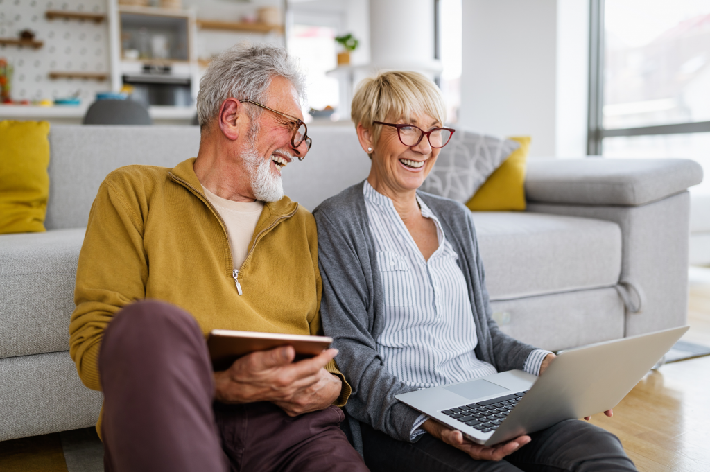 older couple looking at equity release mortgage and debt repayment